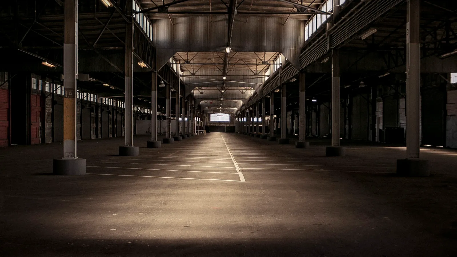 Industrial warehouse and loading docks lit at night